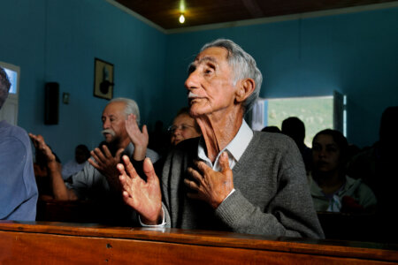 Sunday morning supplication. Lambari, Brazil, 2010 © Steve McCurry.